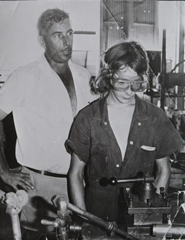 Teacher supervising student in workshop during the 1970s